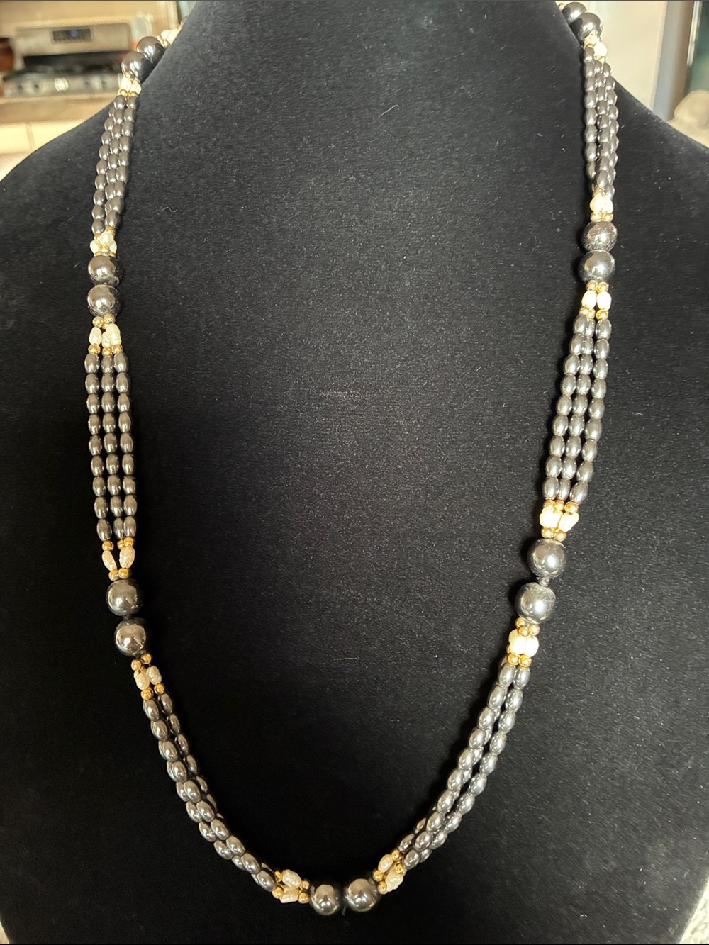 Elegant Gray Beaded Necklace with Gold Accents